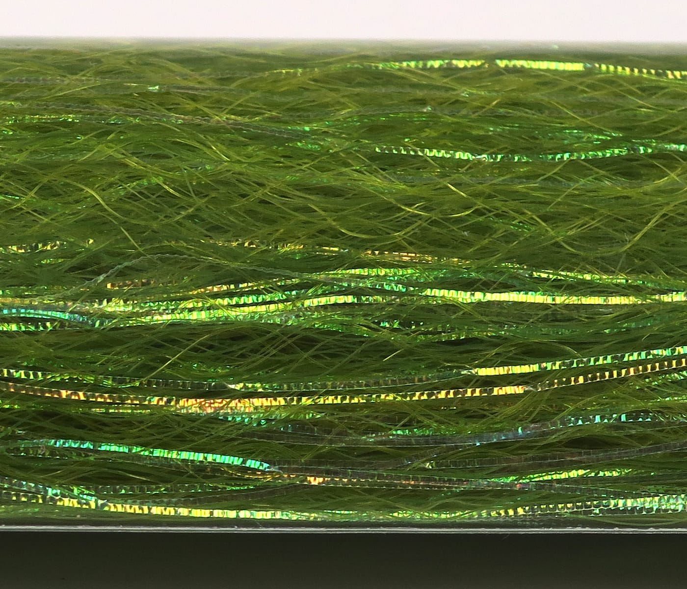 Olive green synthetic fly tying fibers with iridescent slinky flash ribbons, fine hair-like strands