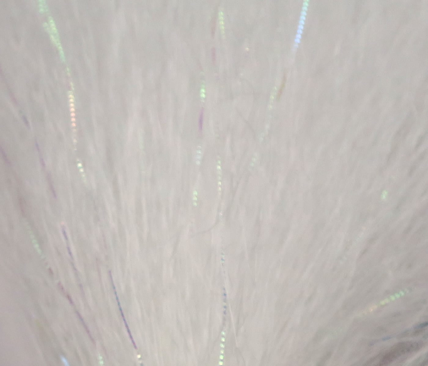 White synthetic fibers with iridescent thin flash strands, fine streamer material for fly tying