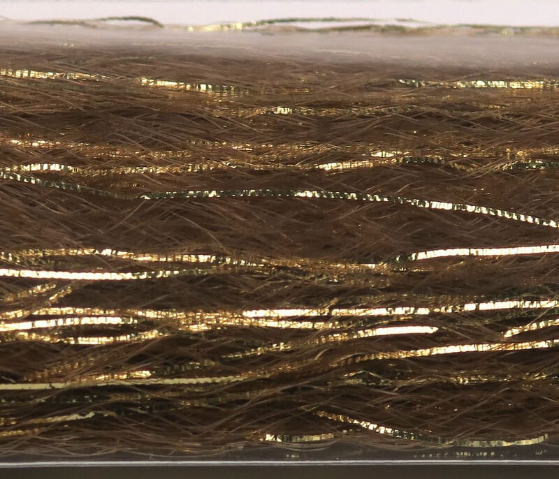 Brown synthetic fibers with thin gold metallic flash strands, glossy slinky material for fly tying