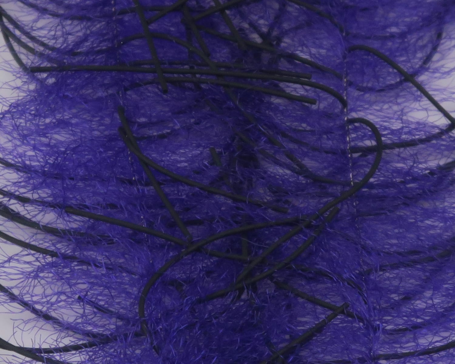 Purple synthetic crustacean brush with black rubber legs and wispy fibers for fly tying lures
