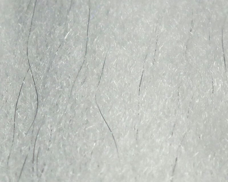 White sculpting flash fibre with shimmering synthetic strands and sparse thin black hairs for fly tying