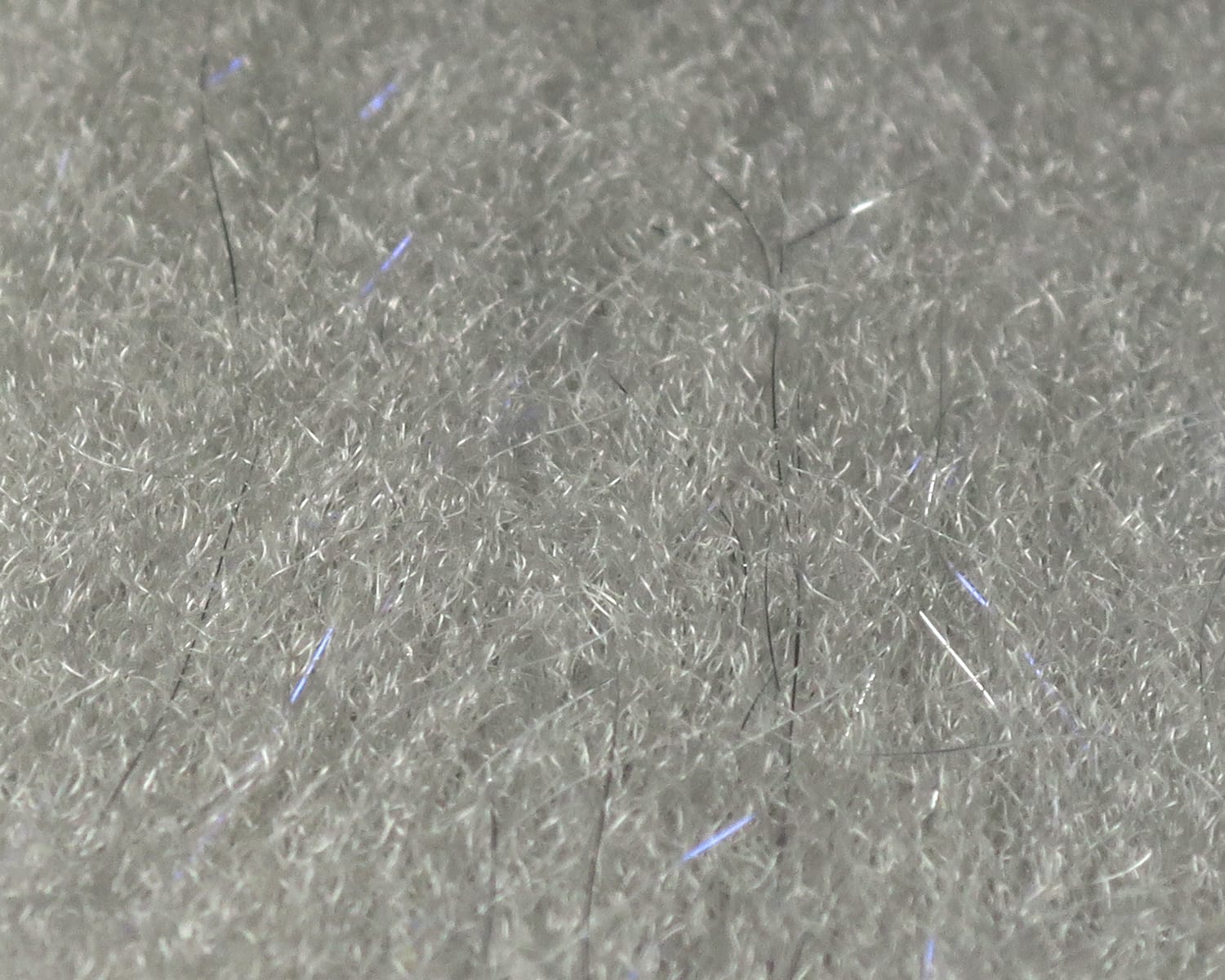 White silver sculpting flash fibre for fly tying, dense fine synthetic fibres with subtle blue iridescent flashes