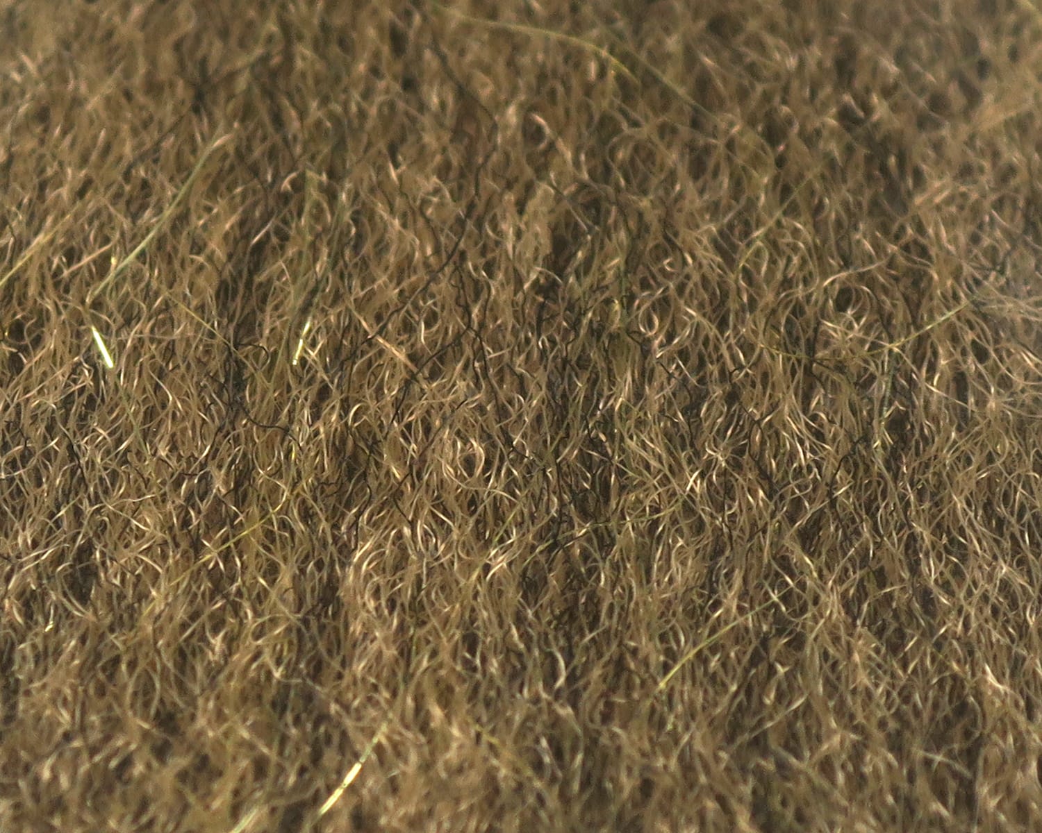Olive-brown sculpting flash fibre with fine curly synthetic strands and subtle green flash for fly tying