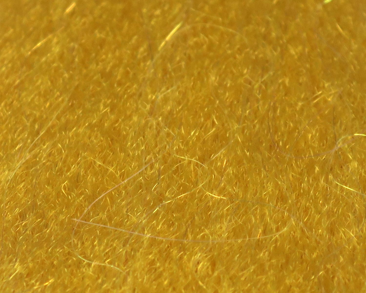 Golden yellow sculpting flash fibre with fine iridescent synthetic strands and shimmer for fly tying