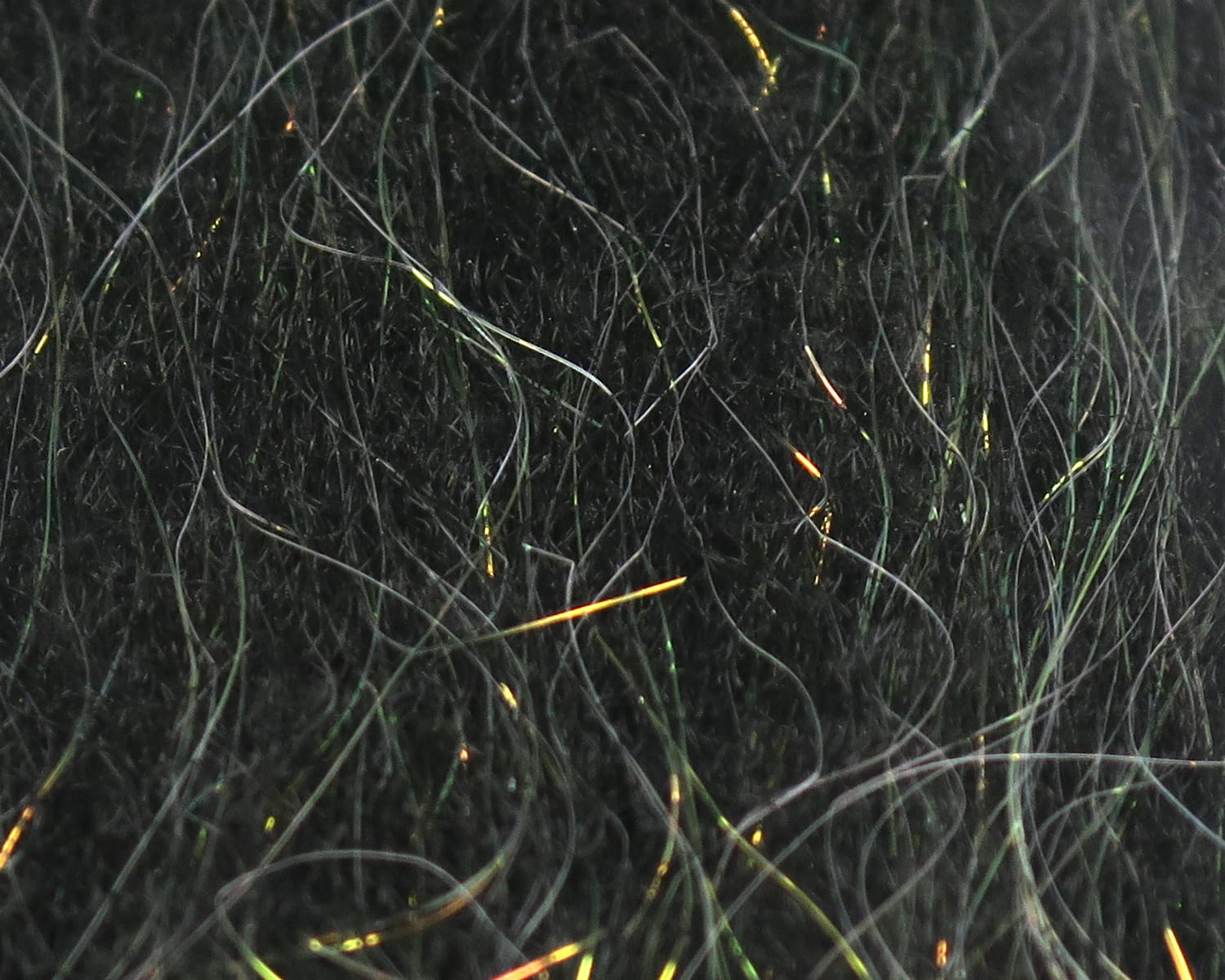 Black sculpting flash fibre with iridescent green and gold thin synthetic strands for fly tying