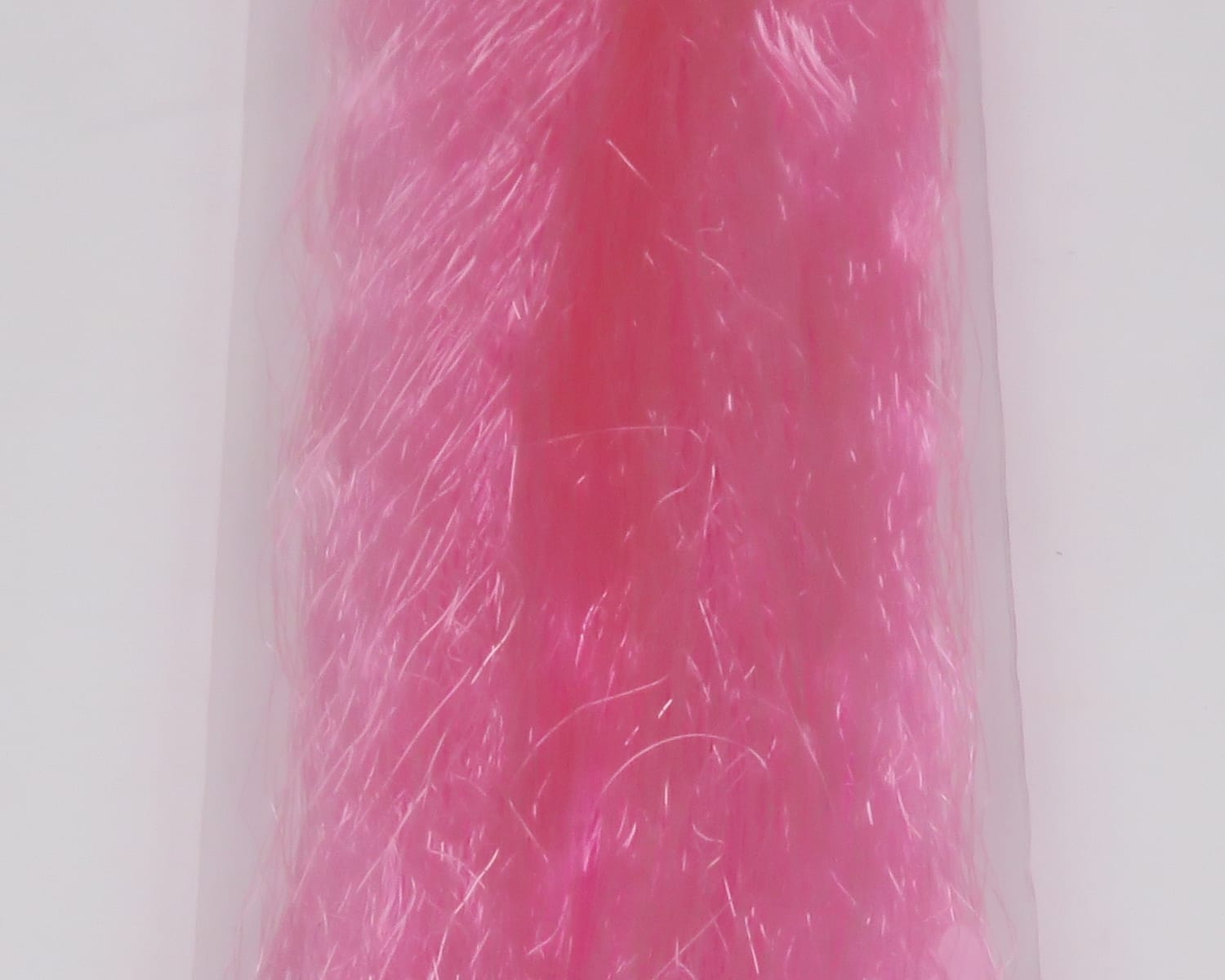 Bright pink synthetic slinky fibre for fly tying, glossy iridescent strands in translucent bag