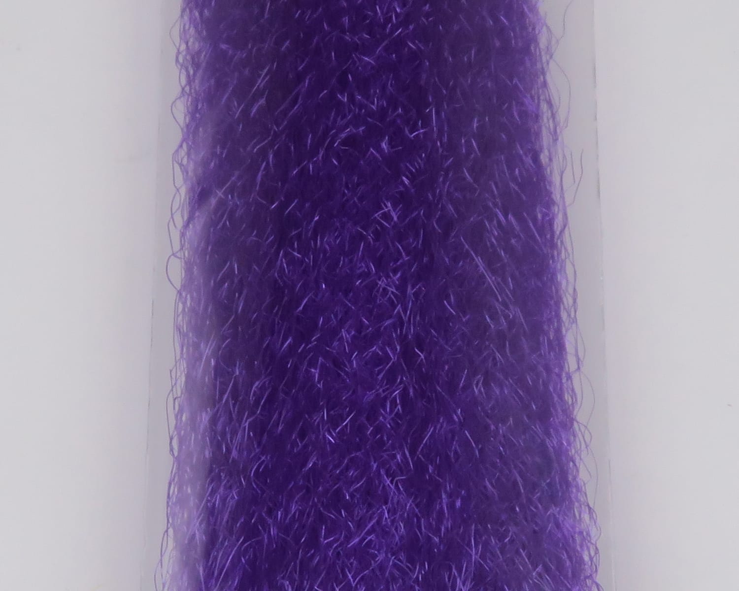 Deep purple slinky fibre for fly tying, glossy synthetic strands with wispy, crinkled texture