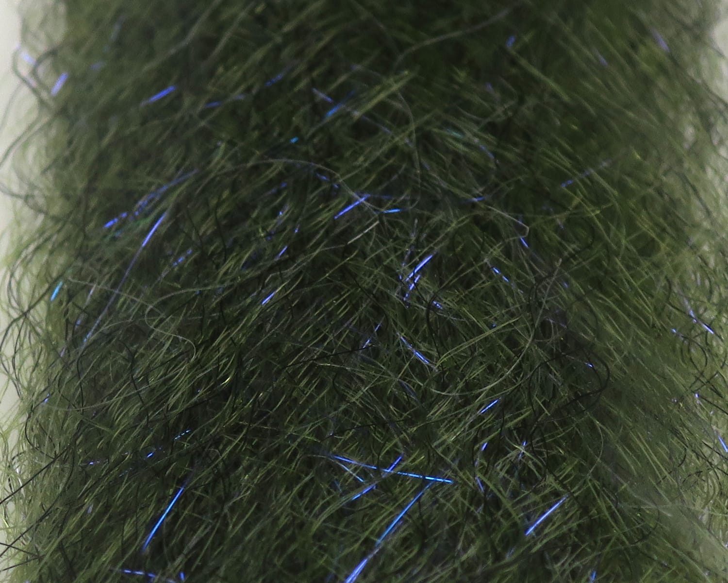Olive-green synthetic fly-tying dubbing UV blend with fine blue iridescent flash fibers and fuzzy hair-like texture