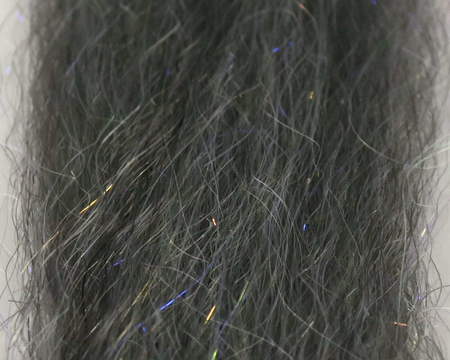 Dark charcoal synthetic fly tying fibers with fine iridescent blue, green and gold flash strands - Just Add H2O UV SF blend