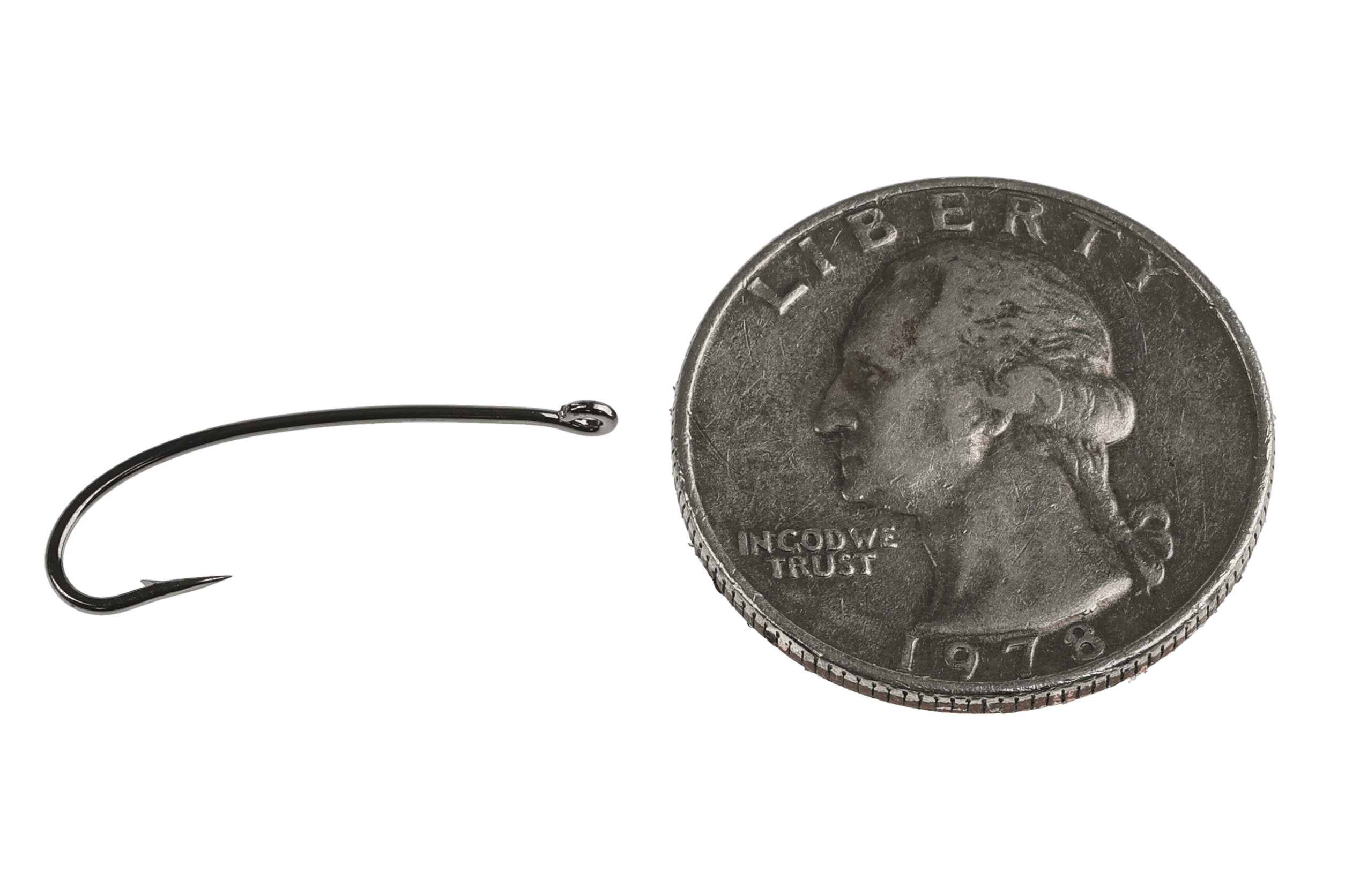 Black nickel curved Kona TND nymph dry fly tying hook with turned-down eye and sharp point beside U.S. quarter for scale