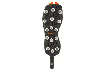 Black Korkers OmniTrax v3 sole with silver aluminum hex discs, aggressive rubber lugs and orange Korkers logo for traction