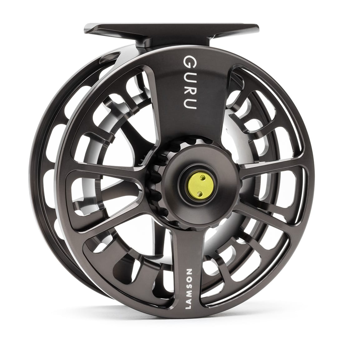Lamson Guru X black fly reel with large arbor design and yellow drag knob, featuring skeletal frame and precision
