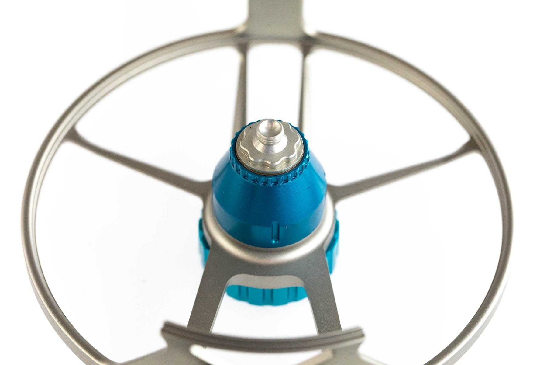 Top view Lamson Litespeed M fly reel hub and blue anodized drag knob with silver skeleton frame