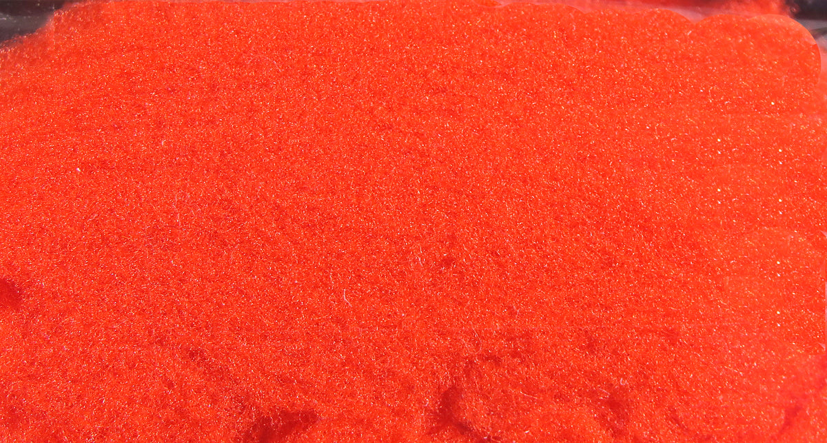 Bright fluorescent red McFlyFoam fly tying yarn, dense sparkly foam texture with fine fibrous strands for tying flies