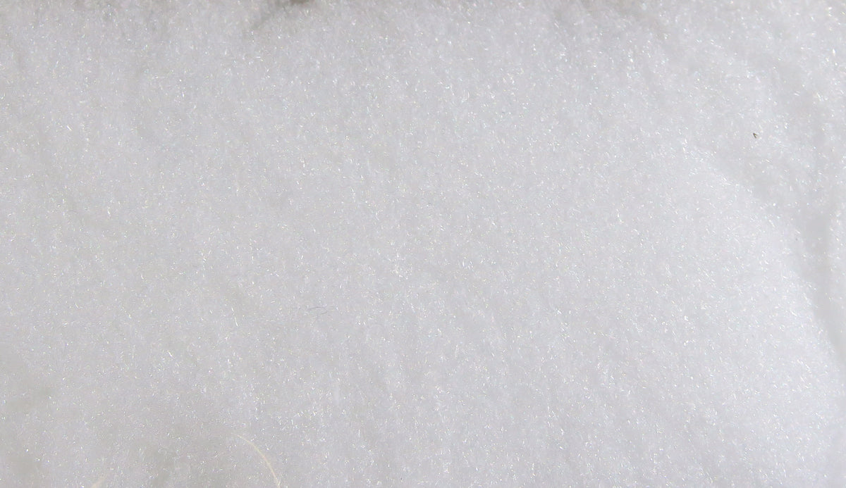 White McFlyFoam fly tying yarn sheet, soft fibrous foam texture with subtle iridescent sparkle