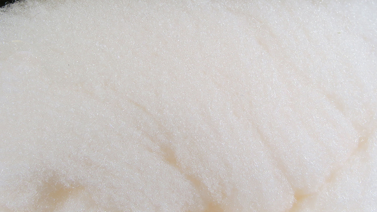 Cream McFlyFoam fly tying yarn showing fluffy synthetic foam fibers with subtle shimmer and fine texture