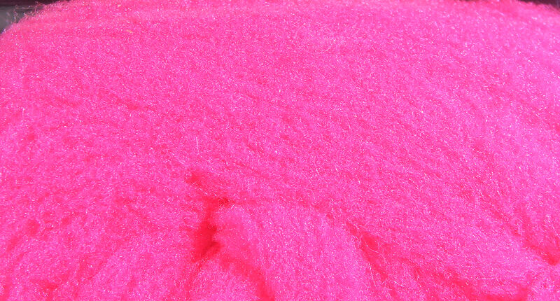 Neon hot pink McFlyFoam fly tying yarn with dense fuzzy synthetic foam fibers, high-visibility color