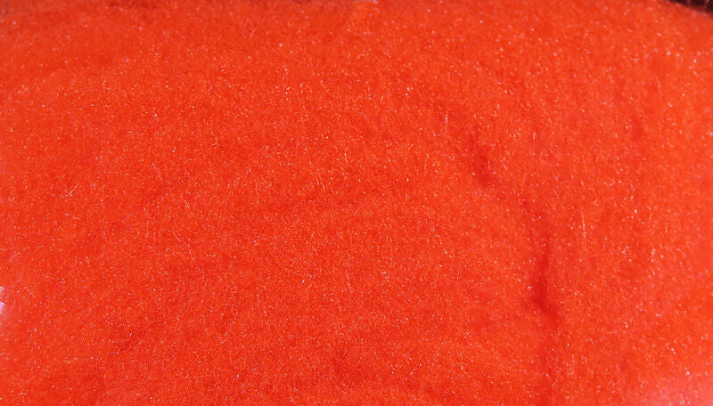 McFlyFoam bright fluorescent orange synthetic foam fly tying yarn with fine sparkling fibers, close-up texture