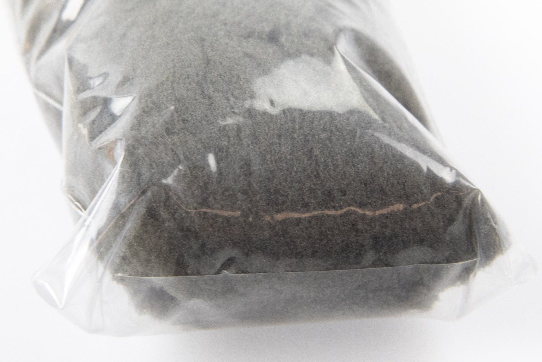 Dark charcoal foam yarn bundle for fly tying wrapped in clear plastic