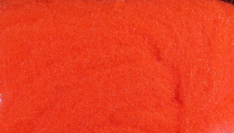 McFlyFoam bright fluorescent orange synthetic foam fly tying yarn with fine sparkling fibers, close-up texture