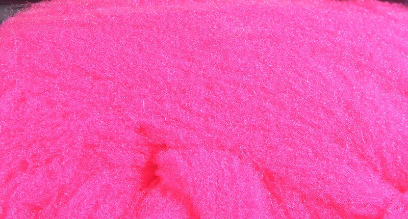 Neon hot pink McFlyFoam fly tying yarn with dense fuzzy synthetic foam fibers, high-visibility color
