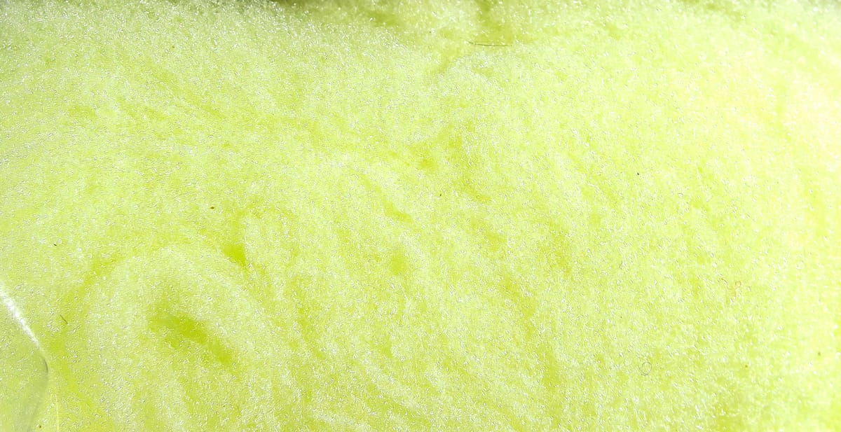 Chartreuse yellow McFlyFoam fly tying yarn close-up of fluffy synthetic foam fibers for fly tying