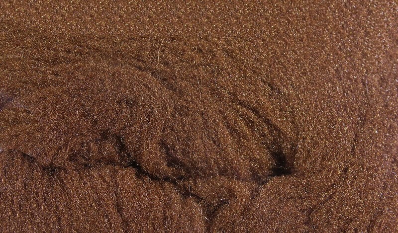 Copper-brown McFlyFoam fly tying yarn with fine metallic foam fibers and textured shimmering surface