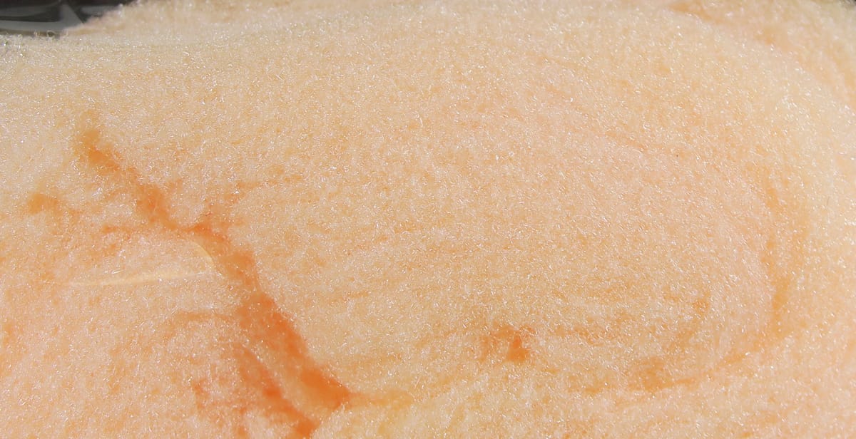 McFlyFoam peach fly tying yarn close-up showing soft fibrous foam texture with subtle sparkle
