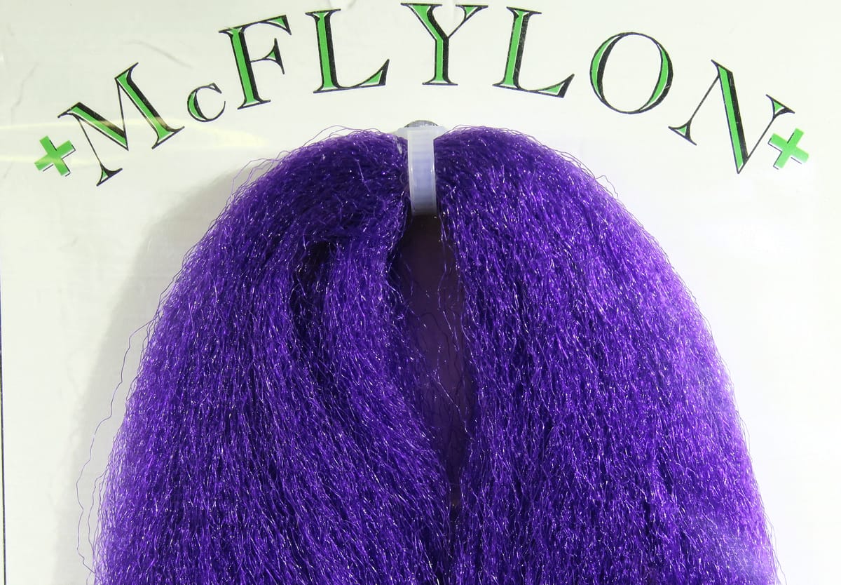 Vibrant purple McFlylon synthetic fibers looped and clipped, glossy fly tying material with fine shimmering strands