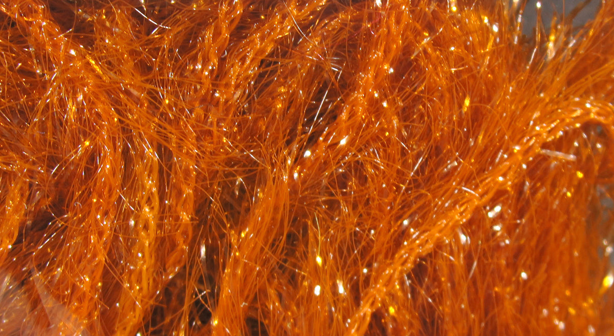 Bright orange Krystal Hackle by Hareline synthetic fly tying flash fibers, glossy shimmering strands with sparkle