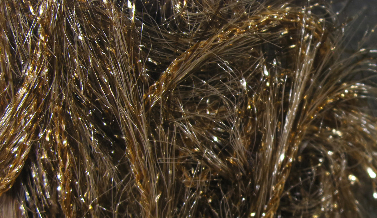 Hareline Krystal Hackle brown synthetic fibers with gold tinsel strands, glittery iridescent fly tying material