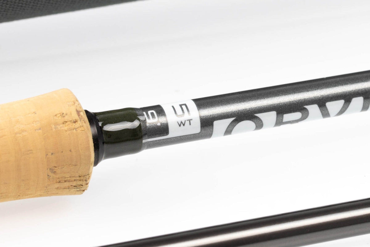 Orvis Clearwater fly rod close-up showing cork handle and graphite black metallic blank with white 5 WT label