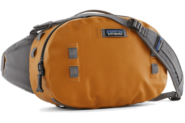Patagonia Guidewater hip pack in burnt orange coated fabric with gray strap, black zipper and Patagonia logo patch