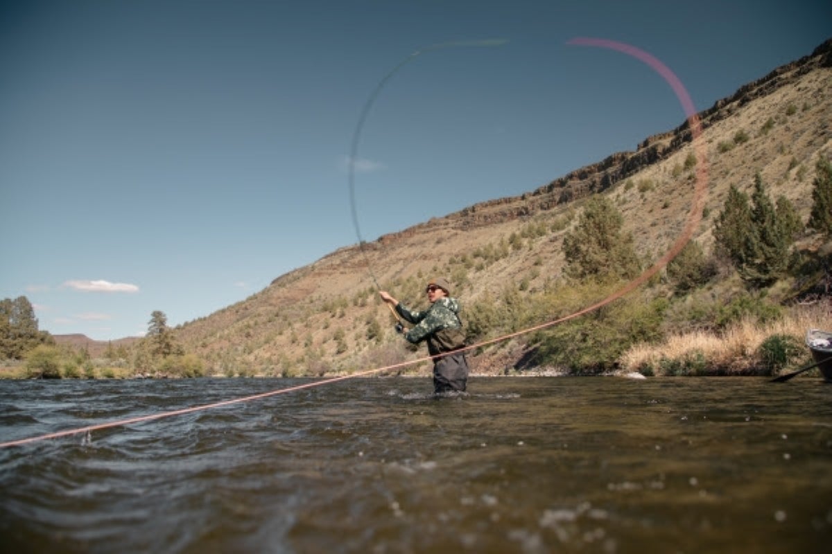 Angler spey casting the St. Croix Physyx Spey Fly Rod on a river