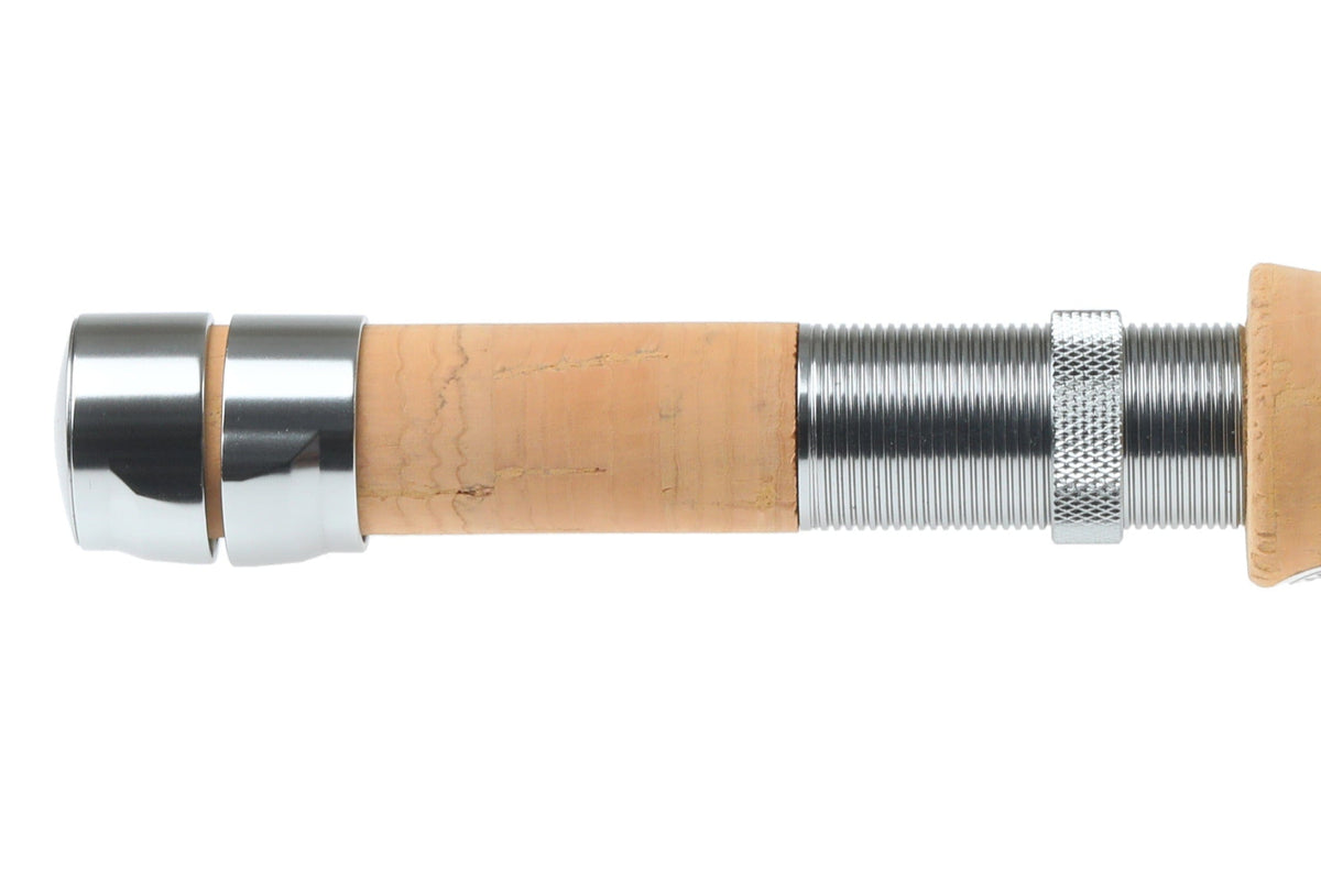 Close-up of Redington Butter Stick fly rod cork handle and silver metal reel seat with knurled locking ring