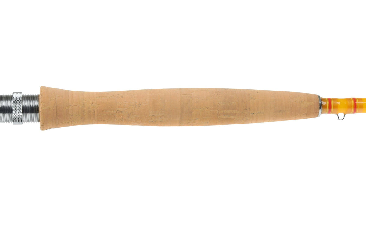 Redington Butter Stick fly rod with natural cork handle and yellow-orange glossy blank accent