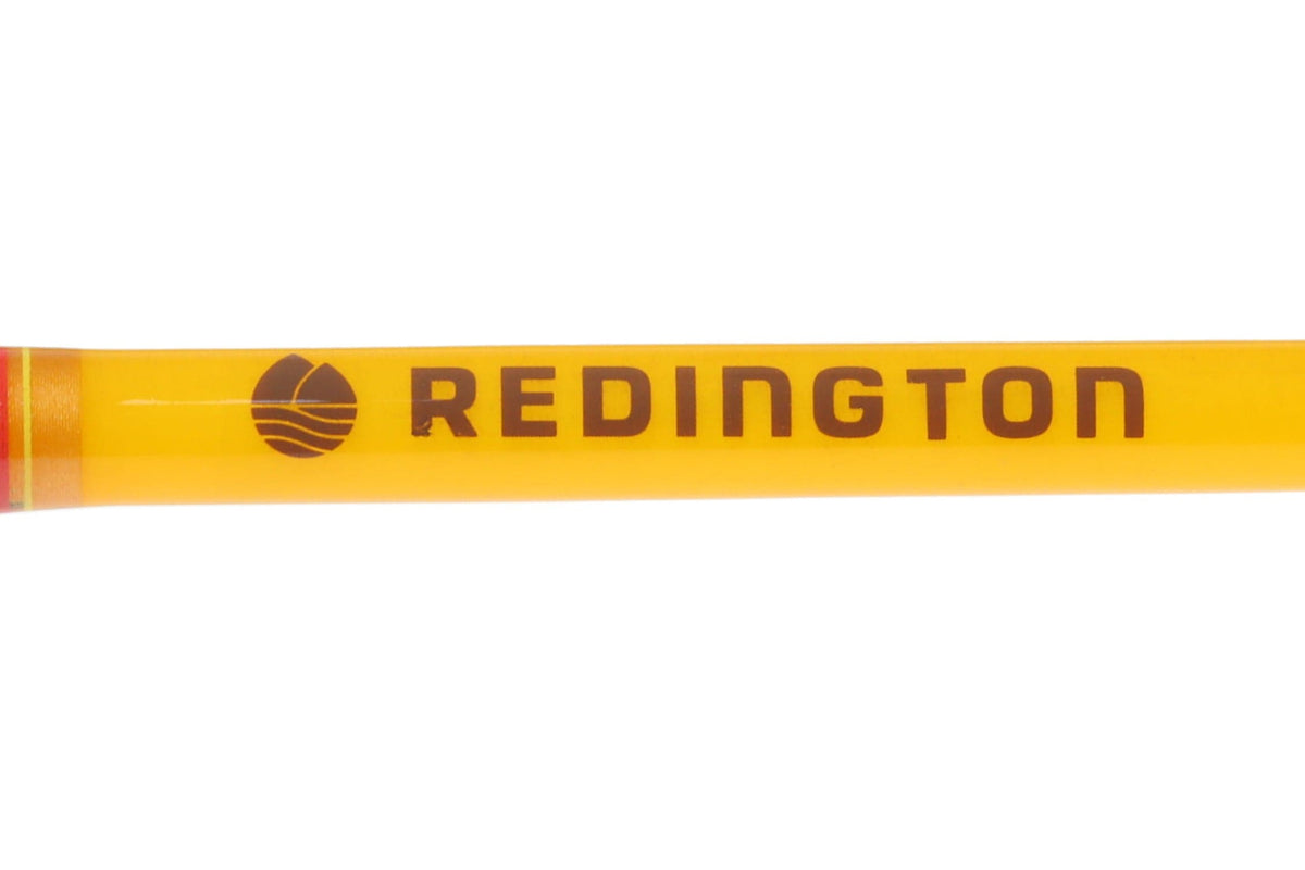 Bright butter-yellow glossy fly rod blank with brown Redington logo and red tip trim