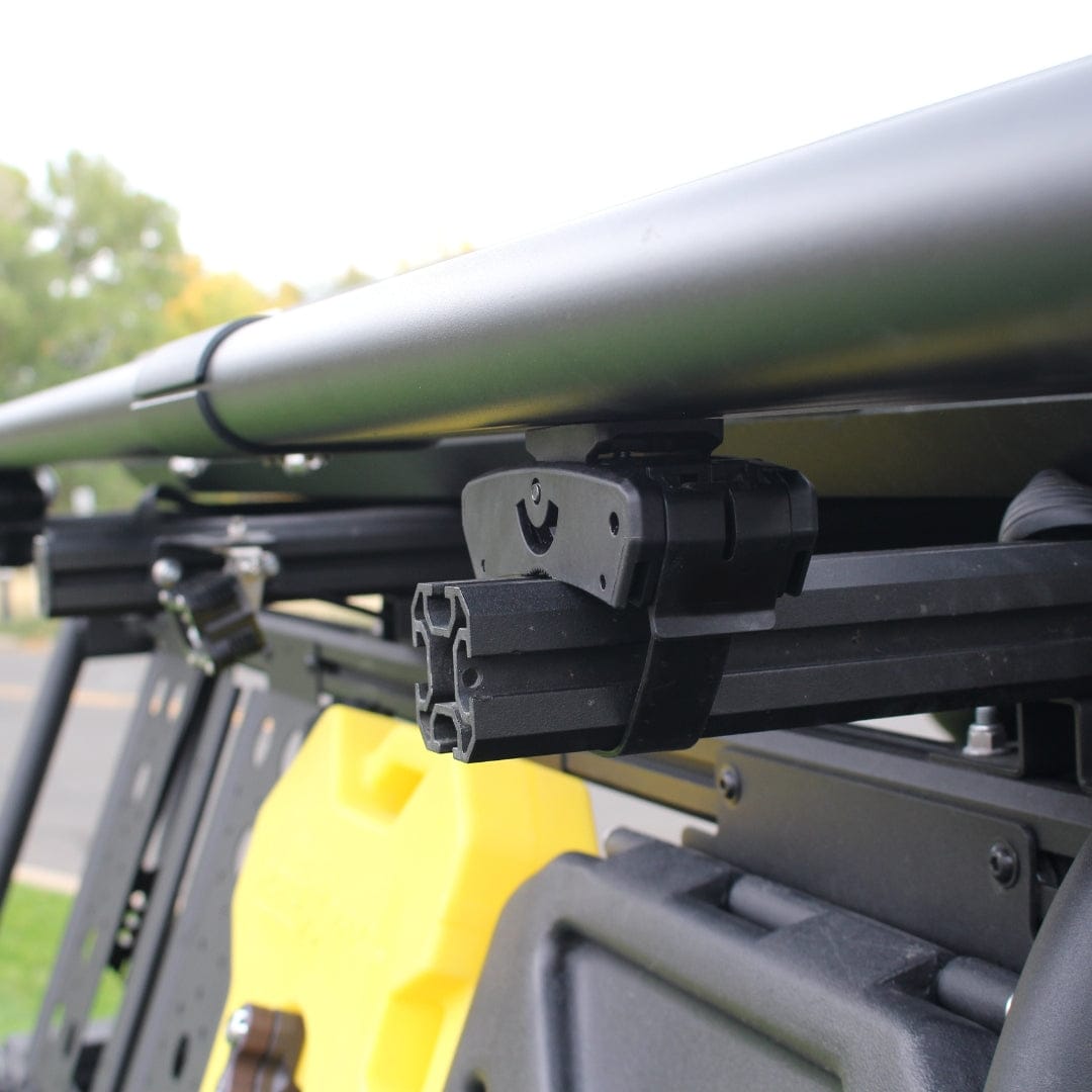 Riversmith Quick Release Mount black metal rod rack accessory on yellow vehicle roof bar
