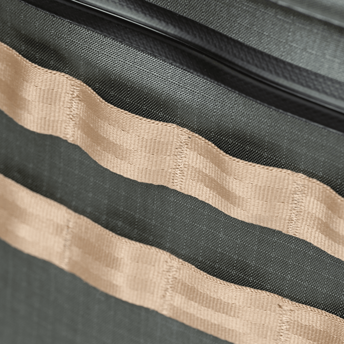 Riversmith Hauler waterproof tote bag detail showing durable canvas straps and charcoal gray fabric construction