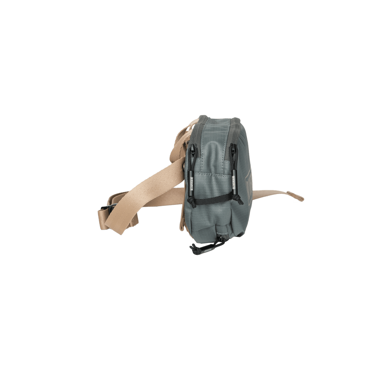 Riversmith PackOut fly fishing sling pack in sage green with tan shoulder strap, shown from side angle