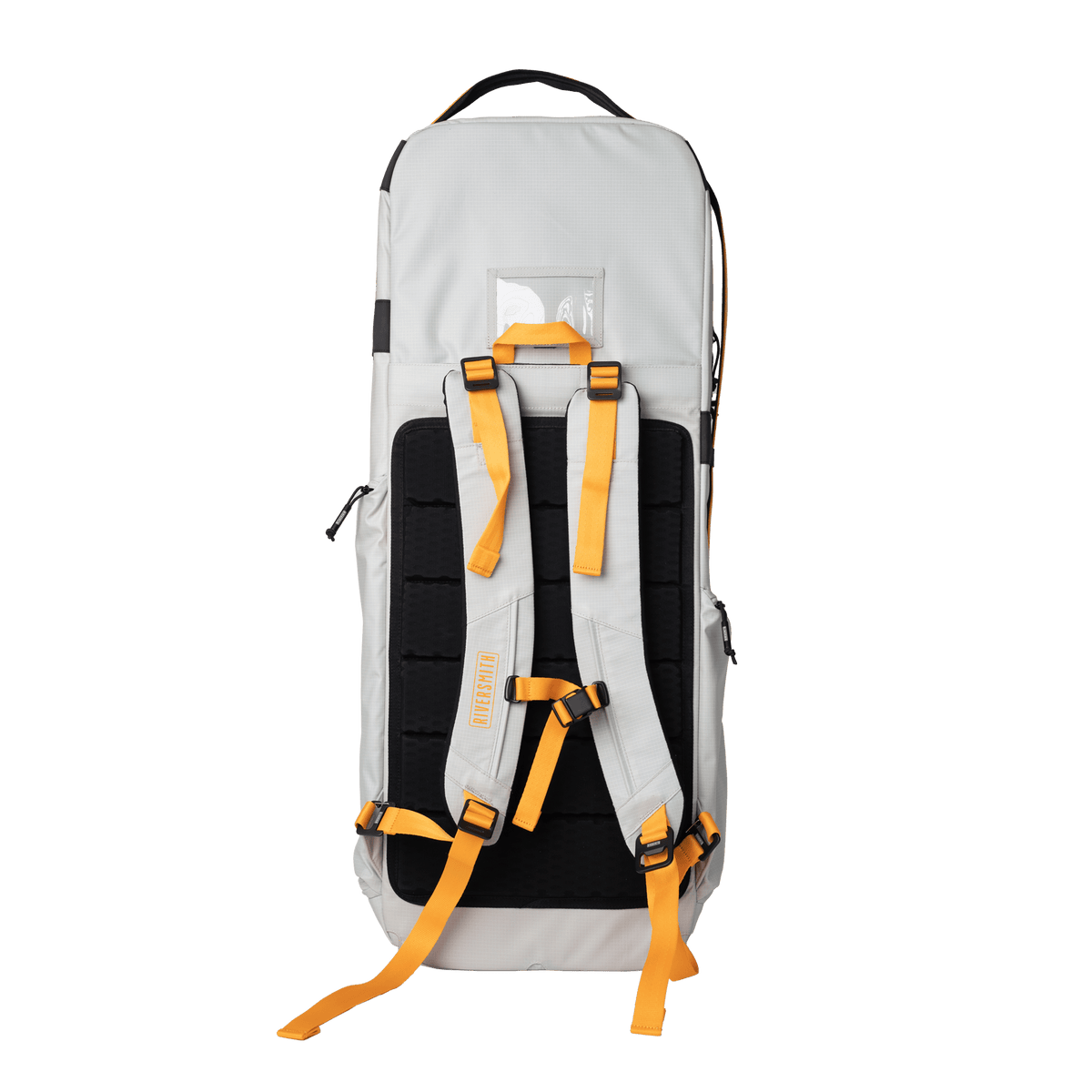 Riversmith The Travel Pack fly fishing travel bag in cream with black back panel and orange straps, shown from rear view