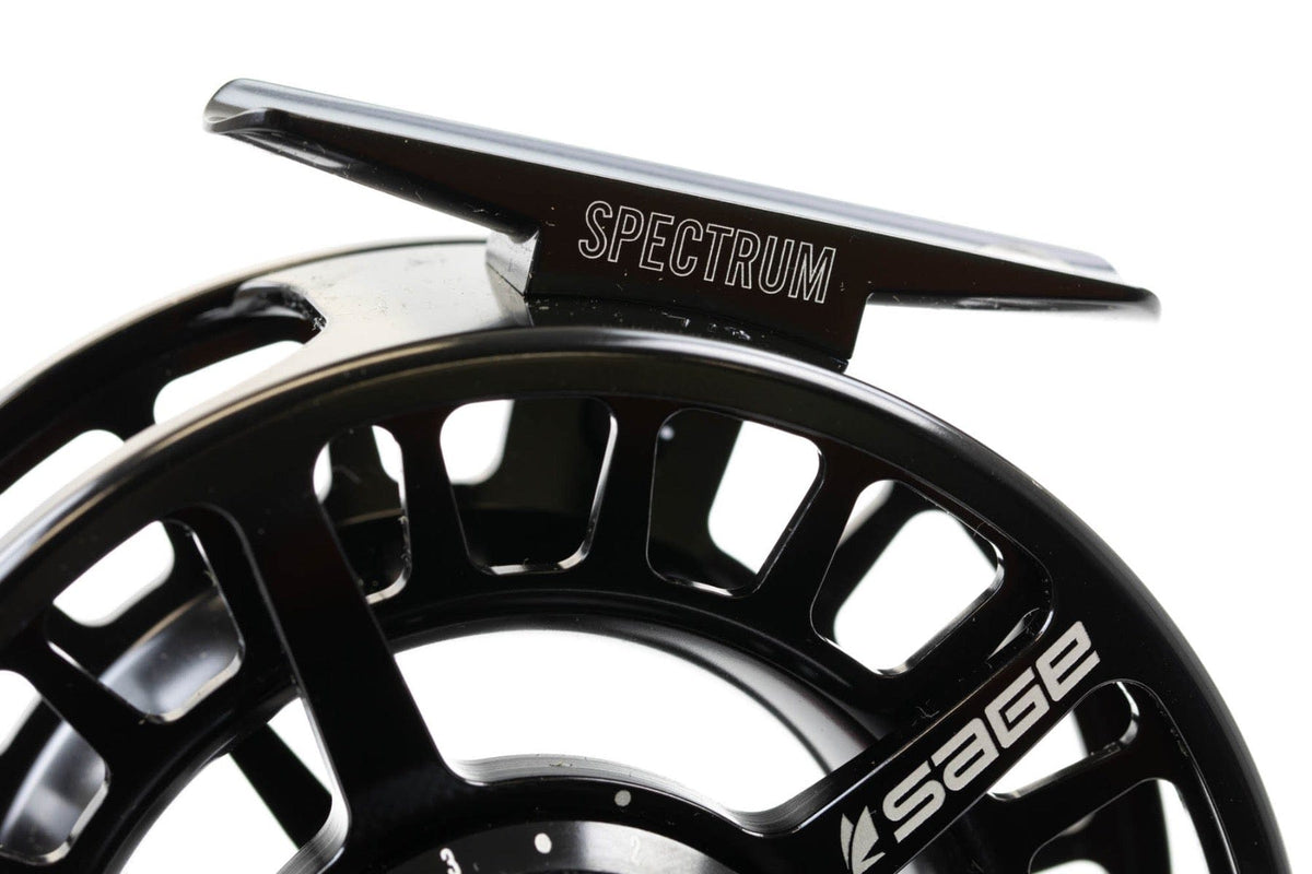 Black anodized Sage Spectrum fly reel with machined ventilated spool and silver Spectrum lettering