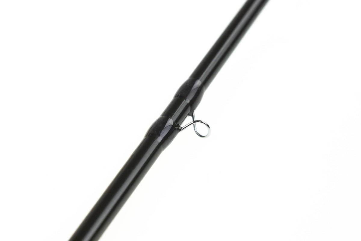 Close-up of Sage R8 Core black glossy graphite fly rod blank with metal guide ring and tapered ferrule detail