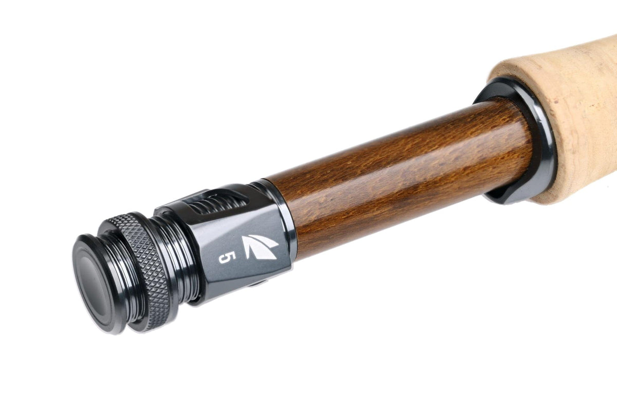Sage R8 Core fly rod reel seat close-up: glossy brown wood insert, black anodized aluminum reel seat and cork handle