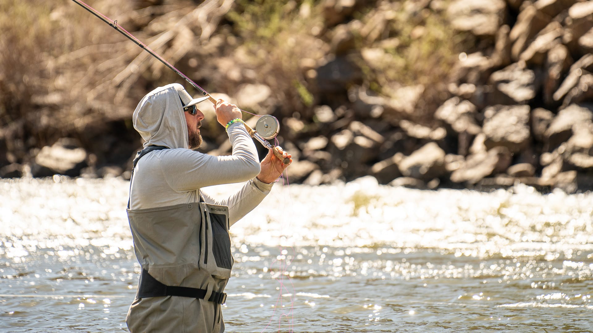 Spey casting the TFO Legacy Two-Handed Fly Rod while wading a river