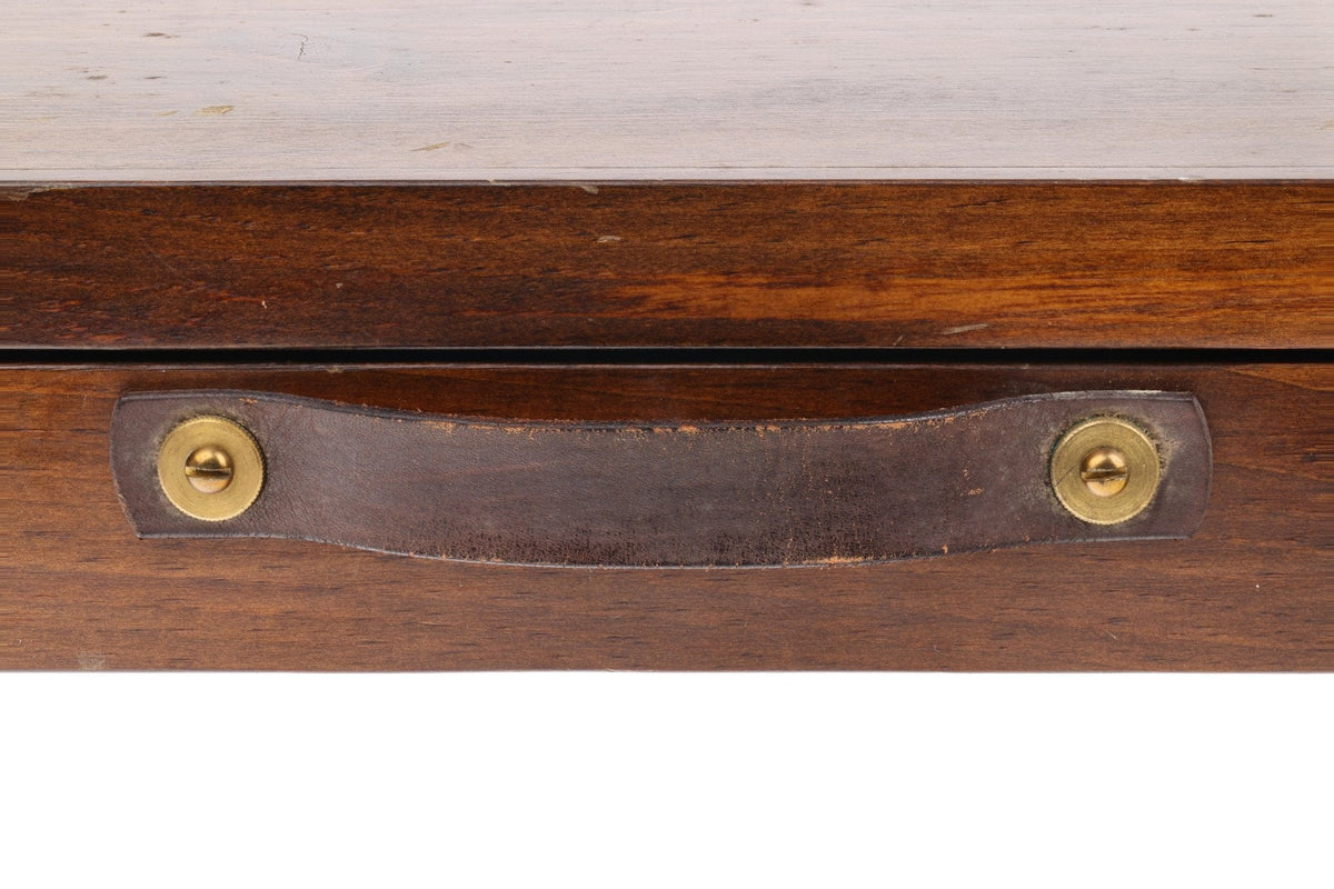 Walnut wooden fly rod case with worn brown leather handle and brass screw fasteners
