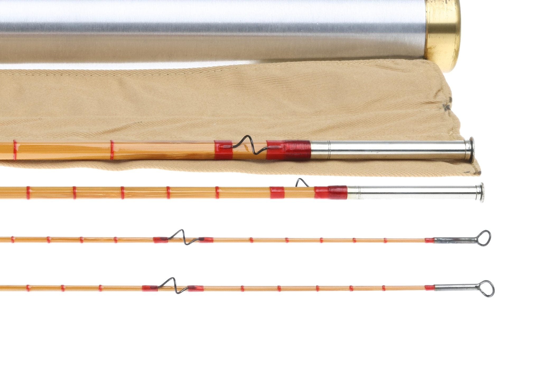Vintage honey bamboo fly rod with red thread wraps, wire snake guides and metal ferrules on tan sleeve and metal tube