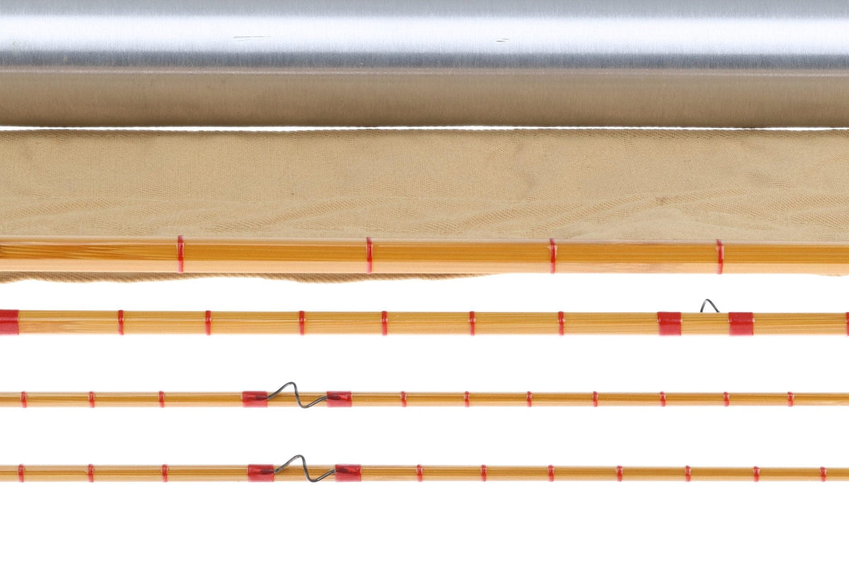 Honey bamboo fly rod sections with red thread wraps, metal guides and silver storage tube, vintage 3-piece 8ft6in 5wt rod