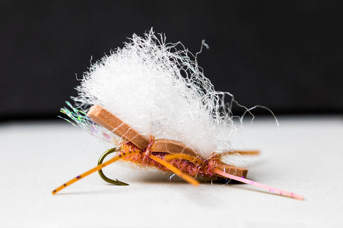 A tan Chubby Chernobyl — closed-cell foam body, white poly-yarn wing, and rubber legs