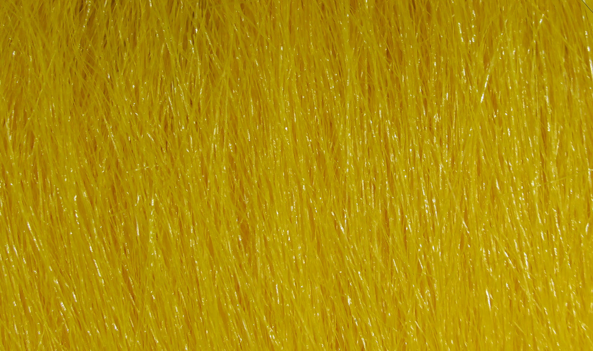 Bright yellow Hareline Extra Select craft fur close-up showing fine glossy synthetic fibers for fly tying